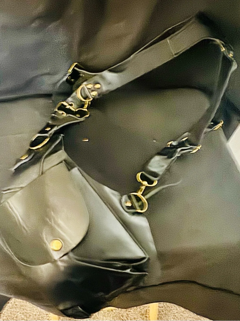 Black Leather Crossbody Harness Bag with Gold Hardware